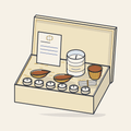 Drawing of an open gift box with brass diyas, a jar candle and tealights